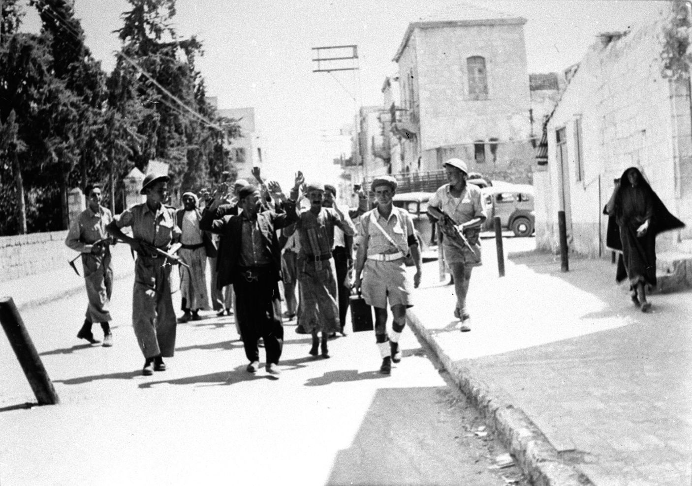 IDF soldiers guarding Palestinians in Ramle, in 1948. Collection of Benno Rothenberg/The IDF and Defense Establishment Archives