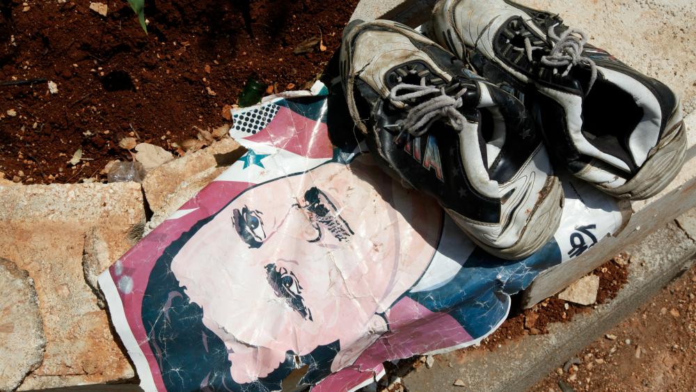 A portrait of Syrian President Bashar al-Assad at the Bab al-Salam border crossing to Turkey